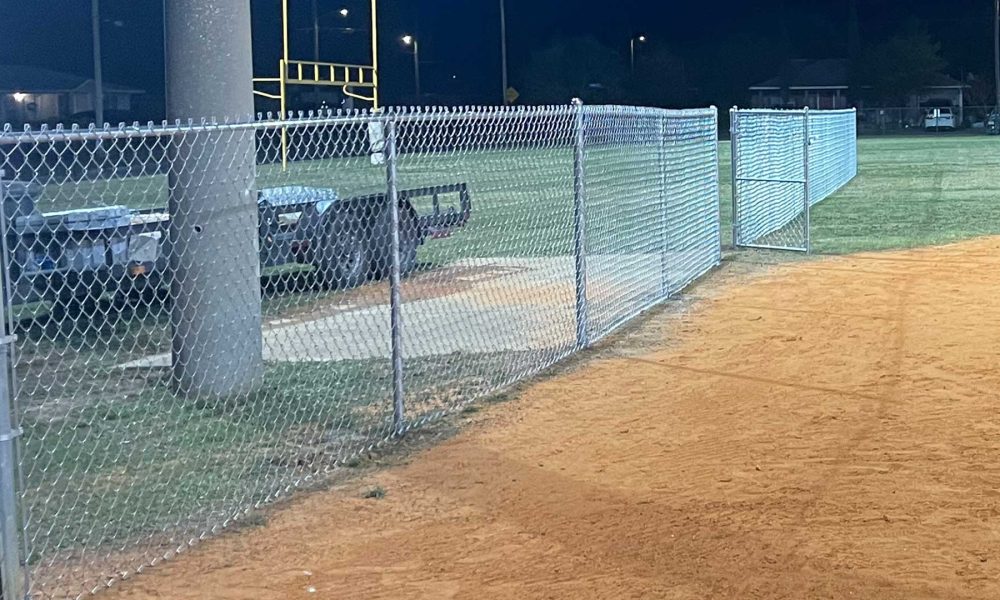 6ft Chin link fence with gate next to a baseball field